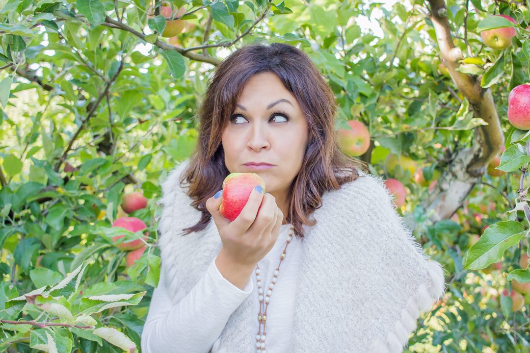 Woman Eating an Apple at Spicers Orchard