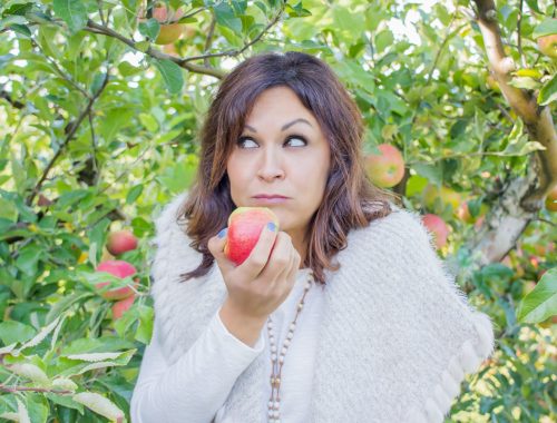 Woman Eating an Apple at Spicers Orchard