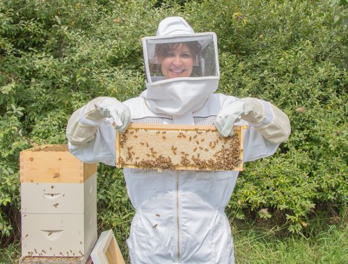 Woman in Bee Suite with Bees